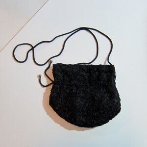 Smart black shoulder bag with raised design